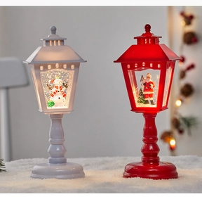 Detail of Christmas lantern with glowing LED light and swirling glitter snow effect