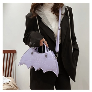 Detail of purple PU leather bat wing handbag with matching crossbody shoulder strap