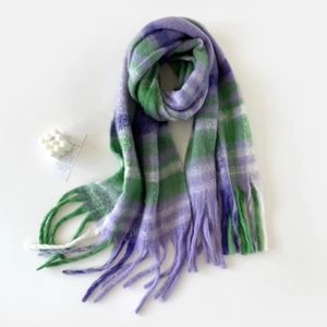 Close-up of soft plaid mohair scarf with purple and green stripes and long fringes