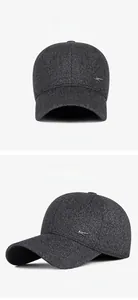 Detail of winter baseball cap showing charcoal tweed fabric and side metal logo