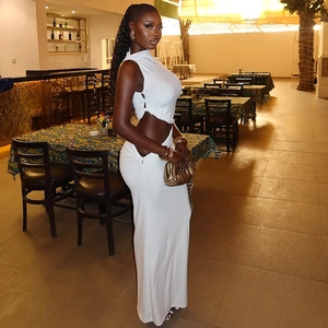 Detailed texture of white halter neck bodycon skirt set in elegant dinner setting
