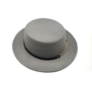Detail of grey wool felt flat top hat featuring black leather band and gold chain link