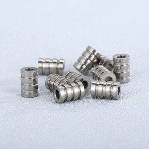 Set of cylindrical stainless steel grooved hardware components for industrial assembly