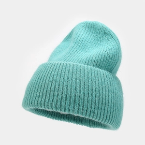 Detail showing plush texture and knit patterns of mint green angora rabbit fur beanie