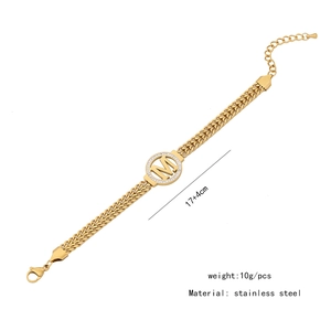 Detail of stainless steel gold bracelet with crystal M letter charm and 17+4cm extension