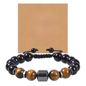 Macro detail of men's tiger eye beaded bracelet with sentimental greeting card for son
