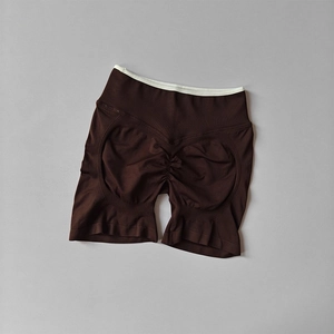 Detail of high waist seamless yoga shorts with ribbed texture and peach butt lifting design