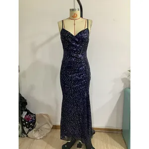 Detail of shimmering purple sequin fishtail dress with deep V-neck and thin straps