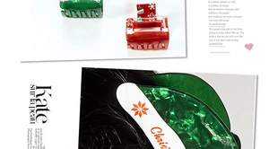 Close-up of festive Christmas hair claw clips with snowflake and ginger man patterns