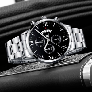 Detailed side view of men's business watch with Roman numerals and silver steel strap