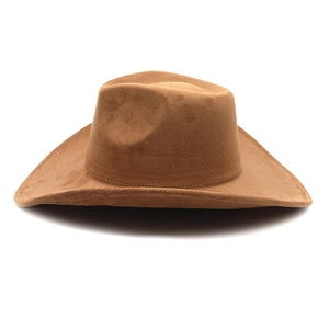 Detailed view of brown suede texture and stitching on wide brim western cowboy hat