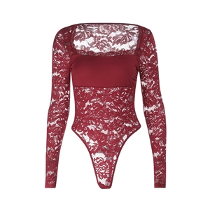 Macro view of the intricate floral lace texture on this dark red long-sleeve bodysuit