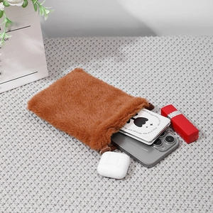 Brown faux fur crossbody phone bag with plush texture on a cozy knitted background