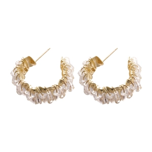 Elegant C-shaped gold metal hoop earrings with hand-woven crystals in retro style