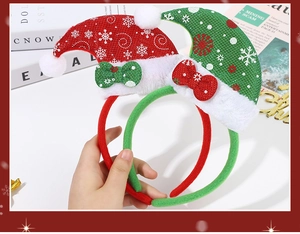 Detail of red and green Christmas antler headbands with plush balls and bowknots