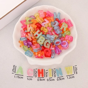 Macro shot of assorted colorful acrylic letter beads with specific size dimensions shown