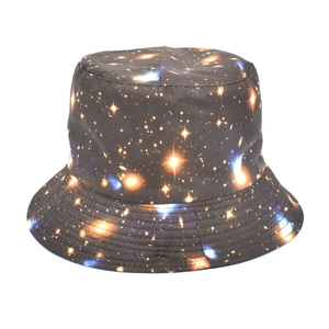 Detailed close-up of galaxy star pattern print on a fabric wide brim sun bucket hat