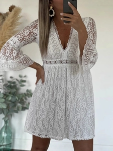 Elegant white lace dress with bell sleeves and V-neckline shown in a stylish mirror selfie