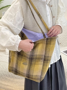 Retro wool plaid tote bag in mustard yellow with spacious purple interior lining