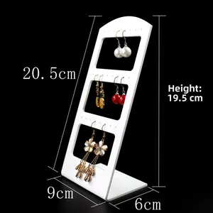 White acrylic earring display stand with L-shaped design and multiple hanging holes
