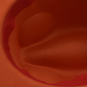 Detailed macro view of the inner crown and ribbed sweatband of the orange wool felt fedora