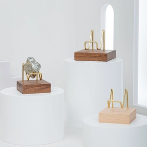 Black walnut and brass display stands for mineral crystals and small stone specimens