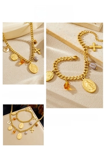Detail of 18K gold-plated oval religious pendant and chunky chain necklace set