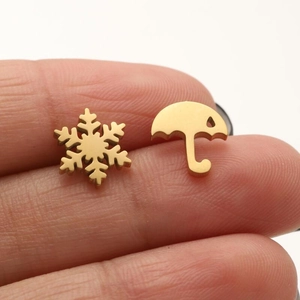 Asymmetric gold snowflake and umbrella stainless steel stud earrings for winter