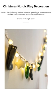 Detail of Nordic Christmas garland with knit socks, stars and warm LED string lights
