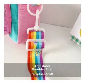 Detail of adjustable rainbow shoulder strap with white plastic buckle for kids bag
