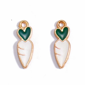 Detail view of carrot-shaped alloy charms with green heart leaves and white gold-edged body