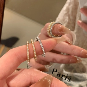 Exquisite 14K gold plated rings with pearls and zircon shown on a hand with mirror reflections