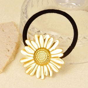 304 stainless steel daisy hair tie with black elastic cord on a natural stone background