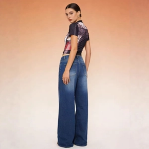 Women high-waist wide-leg jeans in blue denim shown from side-back view on model