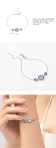 Dettaglio macro del bracciale occhio portafortuna in argento S925 con zirconi e dati