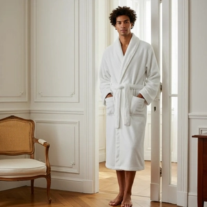 Detailed view of a white flannel robe featuring a classic collar and waist tie belt