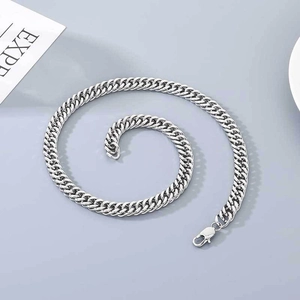 Polished silver curb chain necklace with lobster clasp in a spiral arrangement
