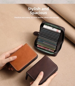 Close-up of accordion style leather card holder with multiple slots and white stitching