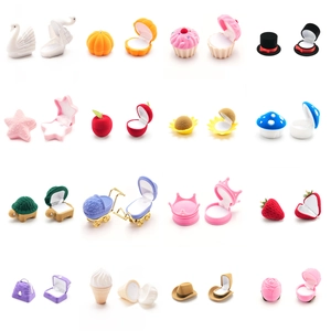 Variety of cute cartoon velvet jewelry boxes in diverse shapes and vibrant colors