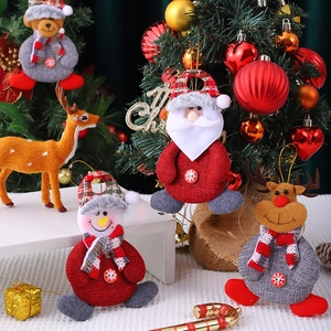 Christmas tree ornaments featuring Santa, Snowman, Reindeer, and Bear in festive knit fabric