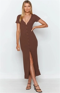 Detail view of brown short sleeve V-neck maxi dress with ribbed texture and front slit