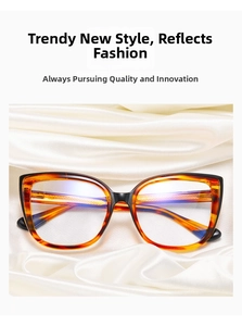 Detalle de gafas cat-eye de carey con lentes anti-luz azul sobre seda blanca