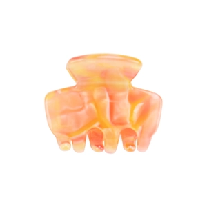 Detailed view of mini acetate hair claw with orange and yellow marble texture