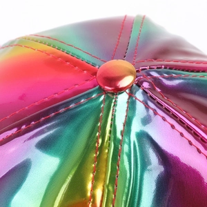 Close-up of rainbow holographic faux leather baseball cap with red stitching details