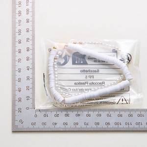 Detailed size measurement of a gold starfish seashell charm anklet with ruler scale