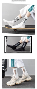 Detail of ribbed cotton sports socks with letter print on classic black and white colors