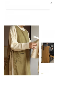 Detail of elegant stain-resistant apron featuring side ties and large pocket with lettering