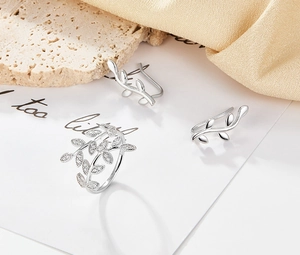 Detail of 925 silver leaf ring and ear cuff set with pavé cubic zirconia accents