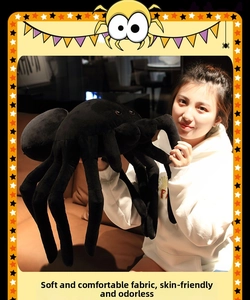 Macro detail of plush black spider doll with long bendable legs and soft fabric texture