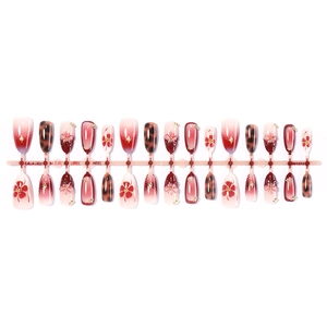 3D floral press-on nails with red gradient flowers and gold stars on almond shape